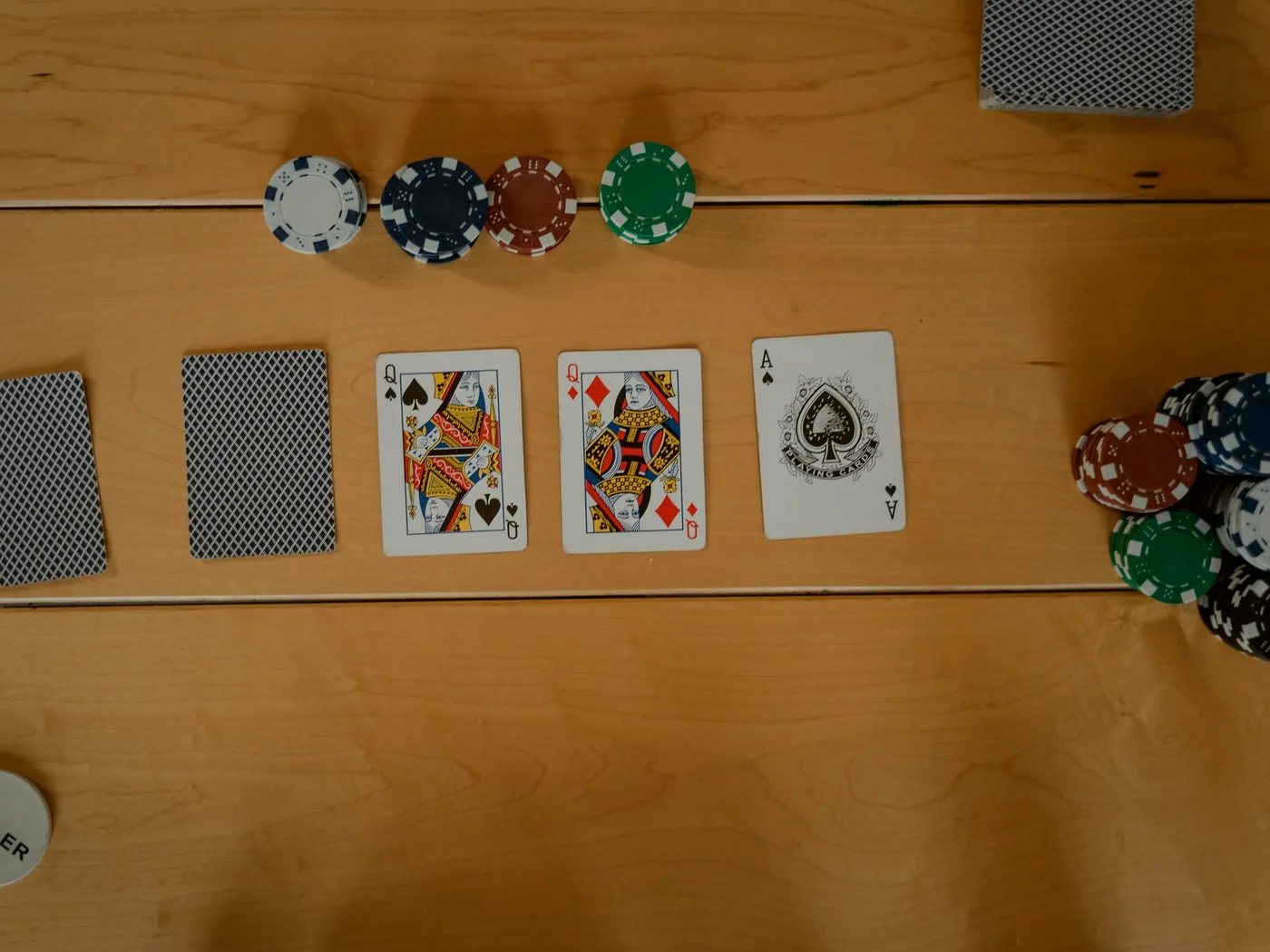 Cards mid-deal on the felt